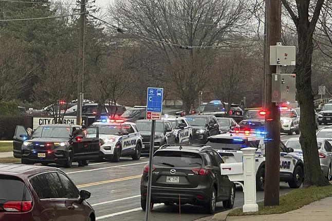 Police and emergency vehicles at the doors of the school in Madison, Wisconsin.