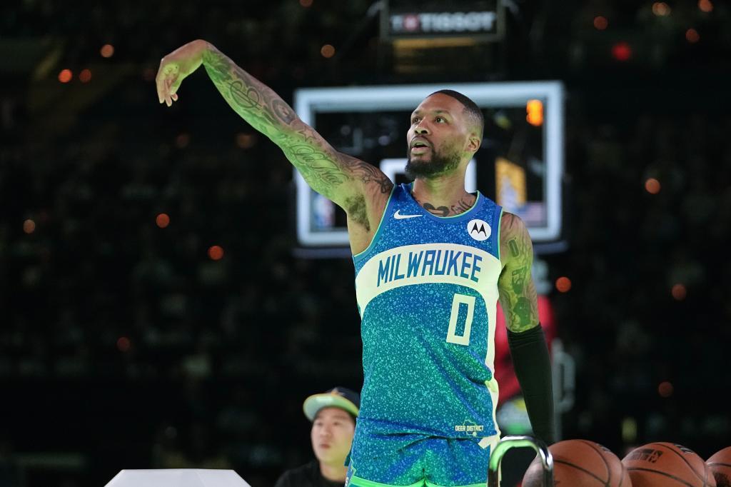 Milwaukee Bucks' Damian Lillard watches his shot during the 3-point contest at the NBA basketball All-Star