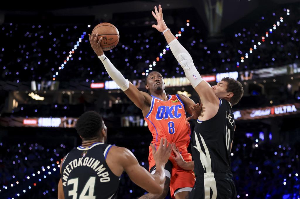 Oklahoma City Thunder forward Jalen Williams (8) shoots against Milwaukee Bucks forward Giannis Antetokounmpo (34) and center Brook Lopez (11)