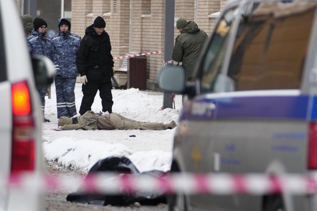 Investigators work at the place where Lt. General Igor Kirillov