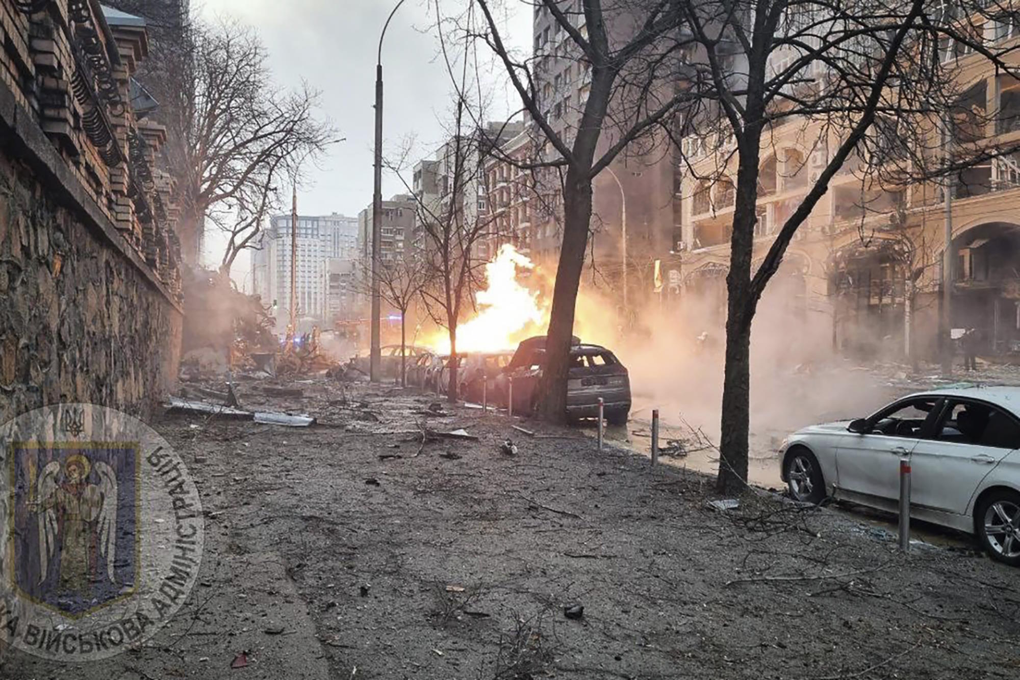 Firefighters work on the site after a Russian missile attack in Kyiv.