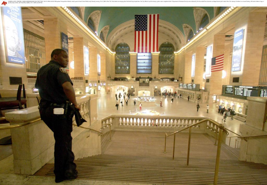 An officer with the Metropolitan Transportation Authority stands guard at Grand Central Station