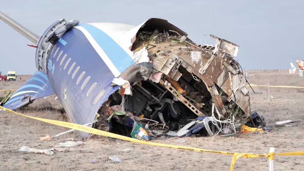 Azerbaijan Airlines Embraer 190 lies on the ground near the airport of Aktau, Kazakhstan