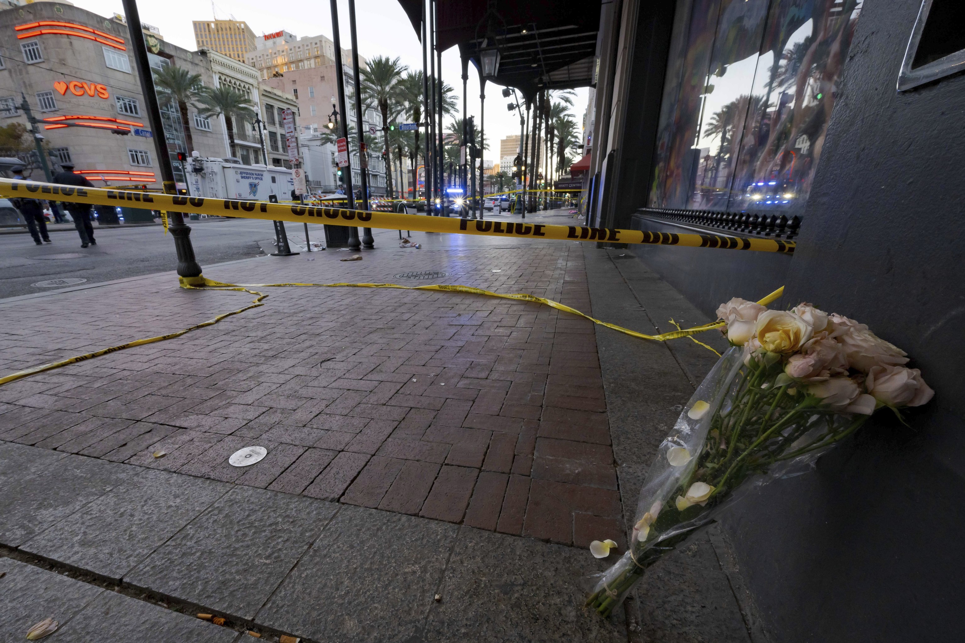 A bouquet of flowers stands at the intersection of Bourbon Street and Canal Street.