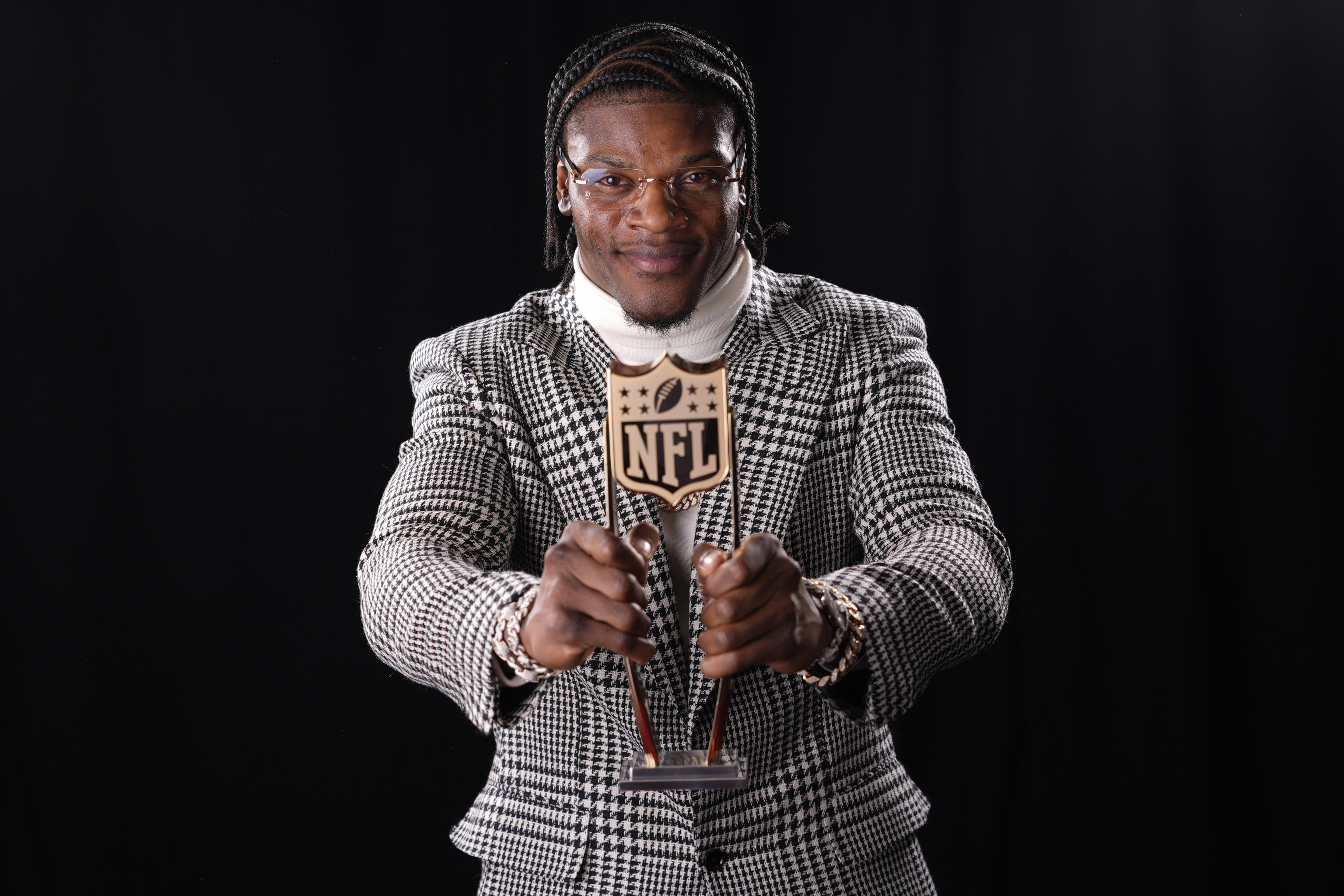 Baltimore Ravens' Lamar Jackson, AP Most valuable player, poses after winning the award.