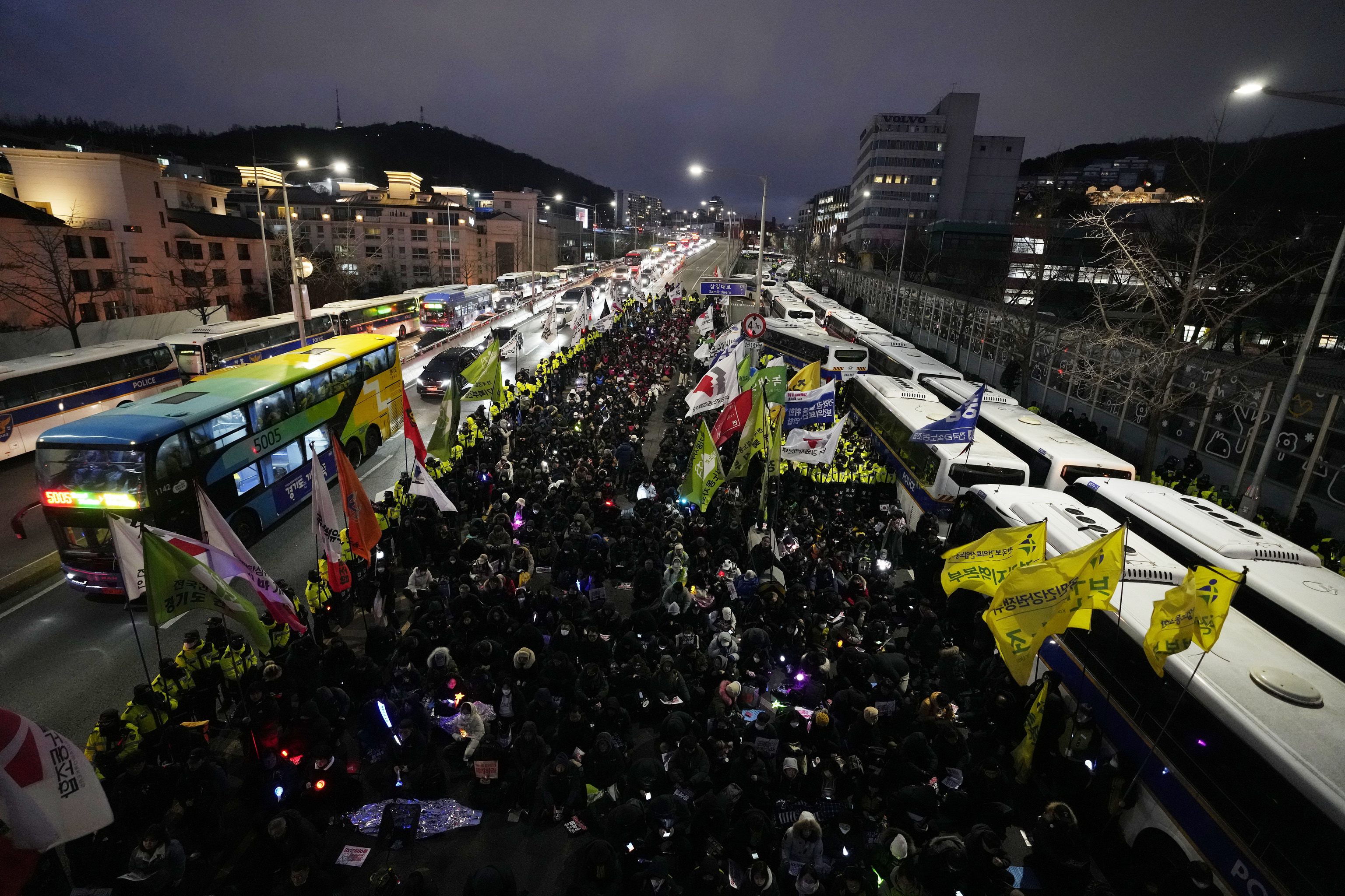 Members of the Korean Confederation of Trade Unions stage a rally demanding the arrest of impeached President Yoon Suk Yeol.