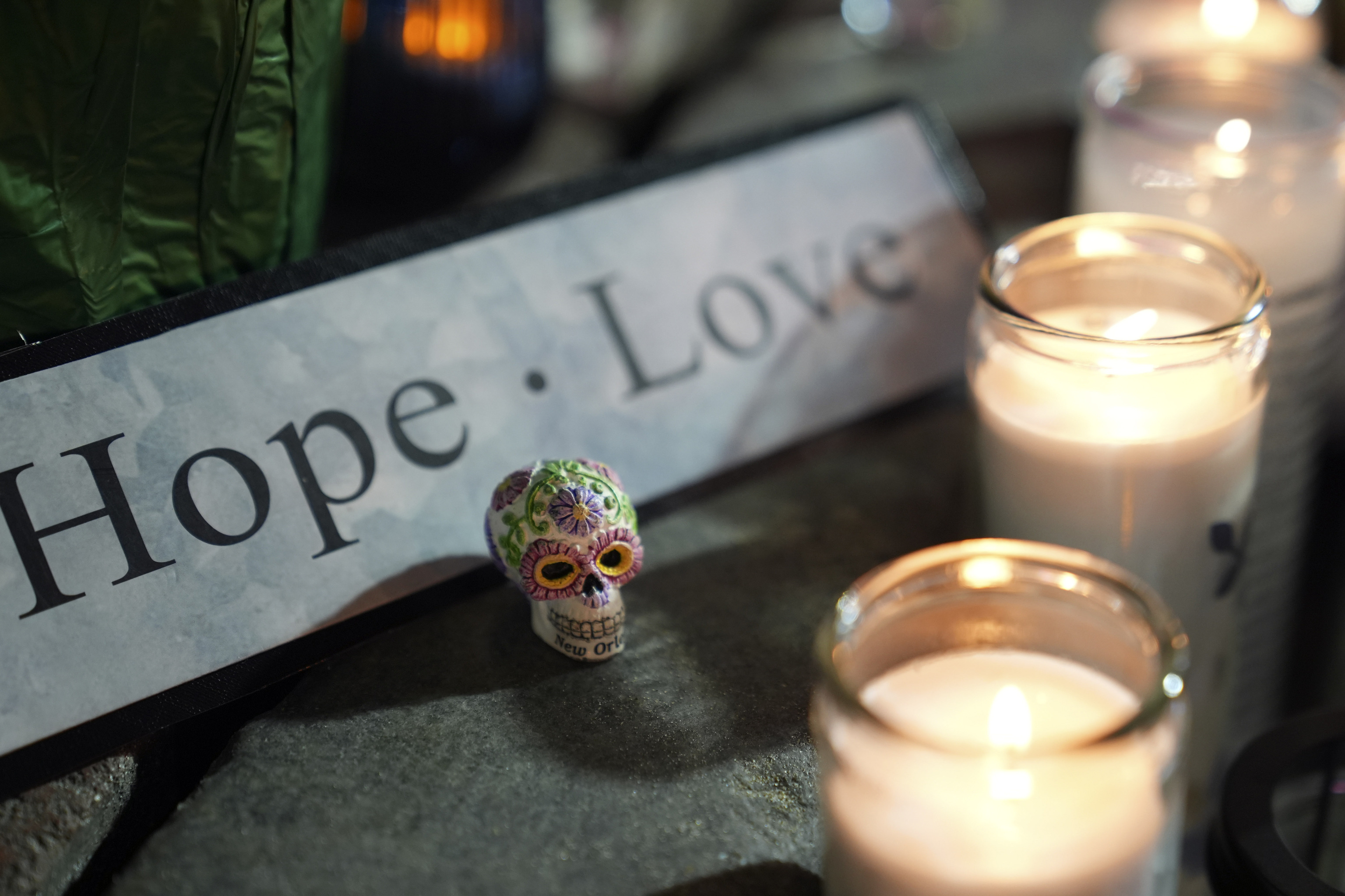 A memorial sits outside a restaurant along Bourbon Street in the French Quarter.