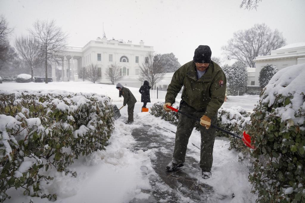 National Park Service workers during a winter storm at the White House.