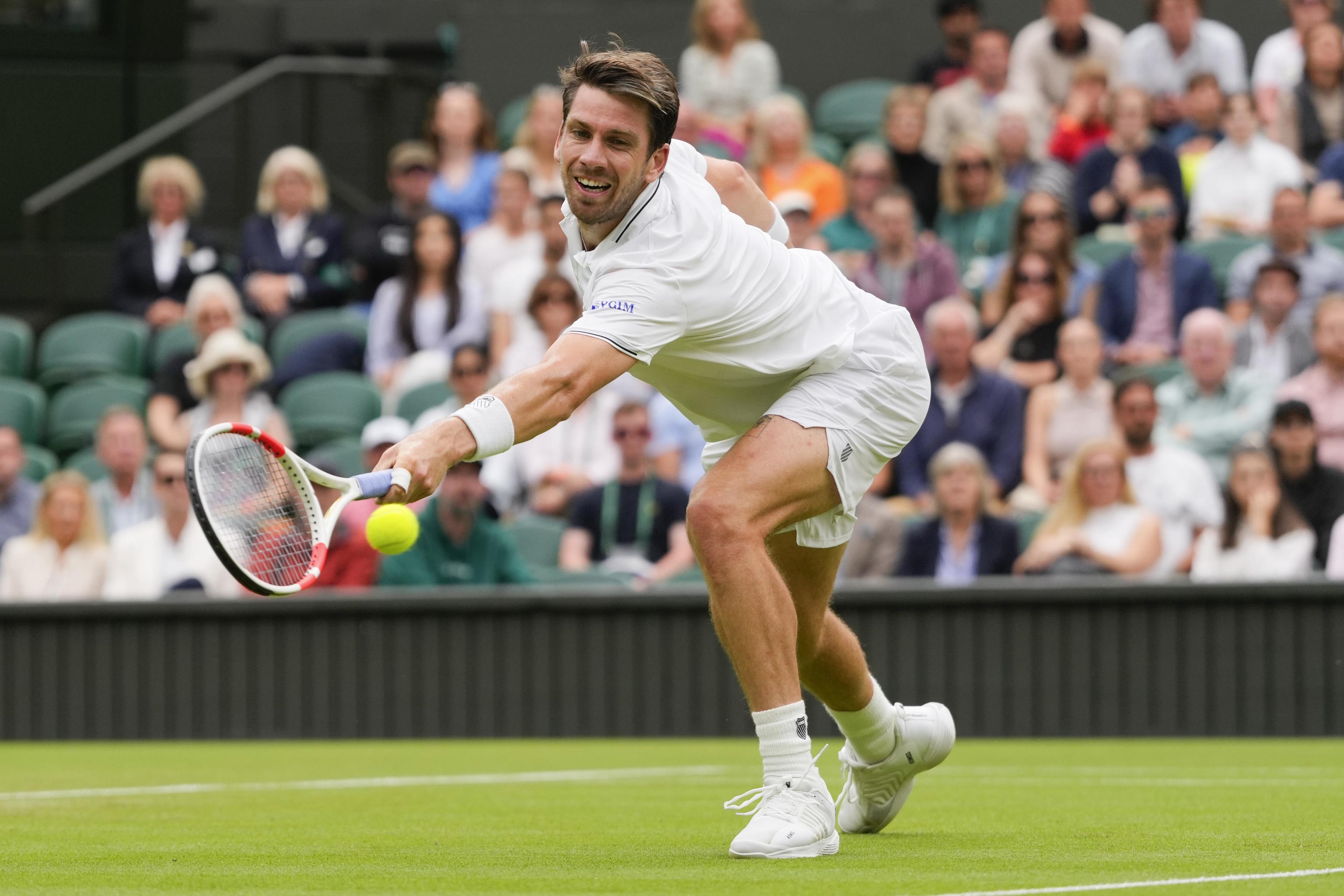 Cameron Norrie, of Britain, plays a backhand return.