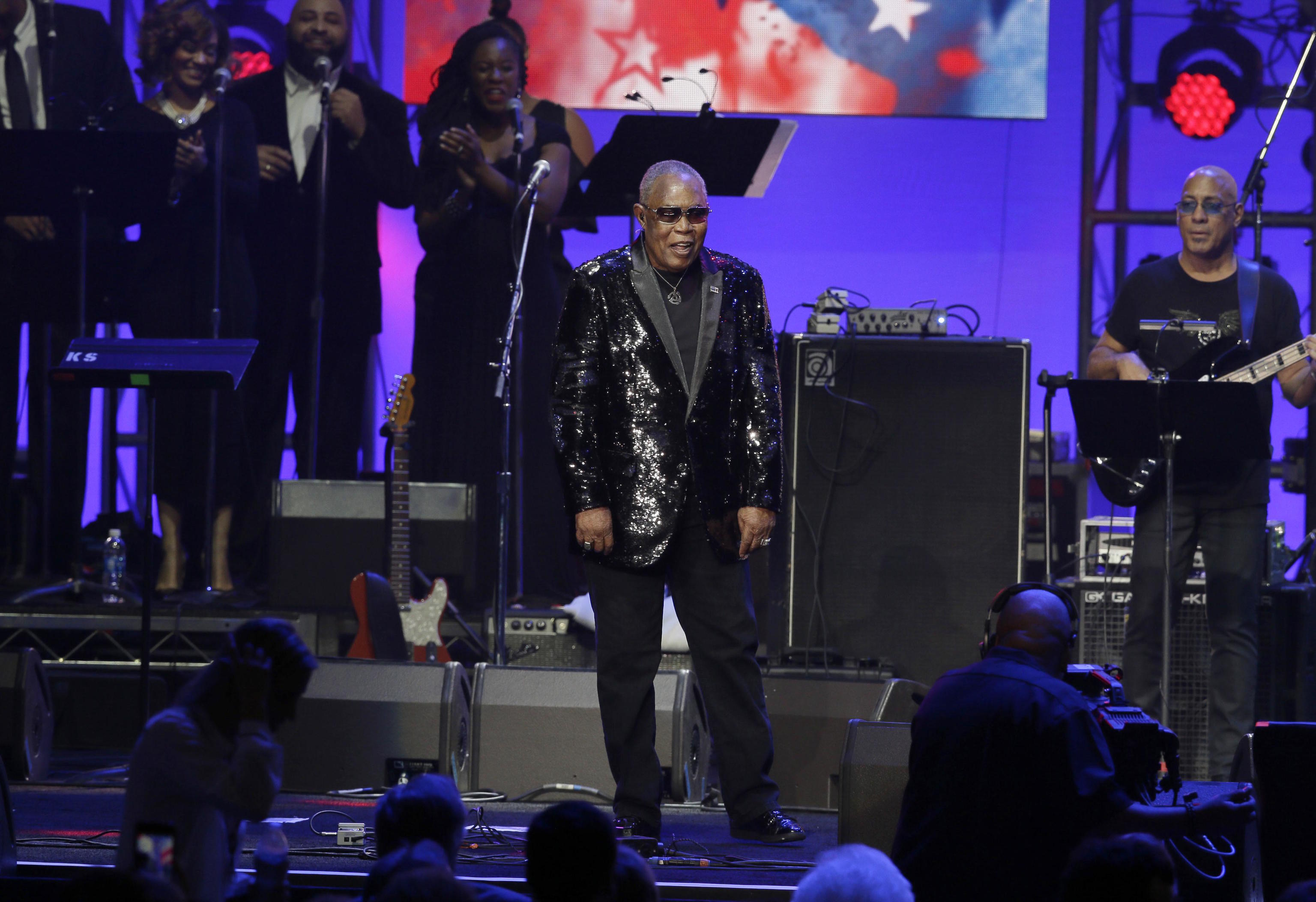 Sam Moore walks on stage to perform in Texas.