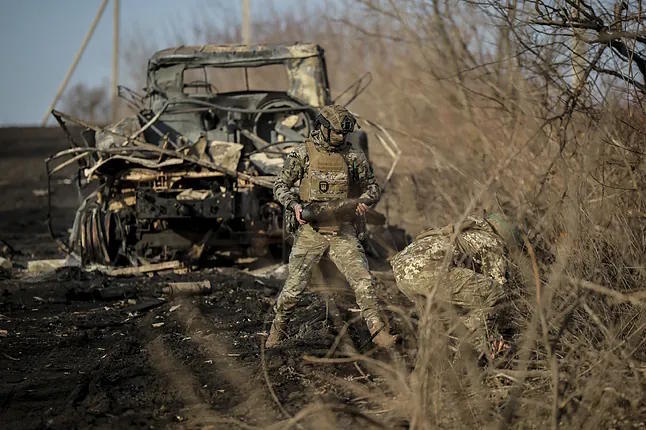 Ukrainian Soldiers Collect Damaged Ammunition near the City of Chasiv Yar.