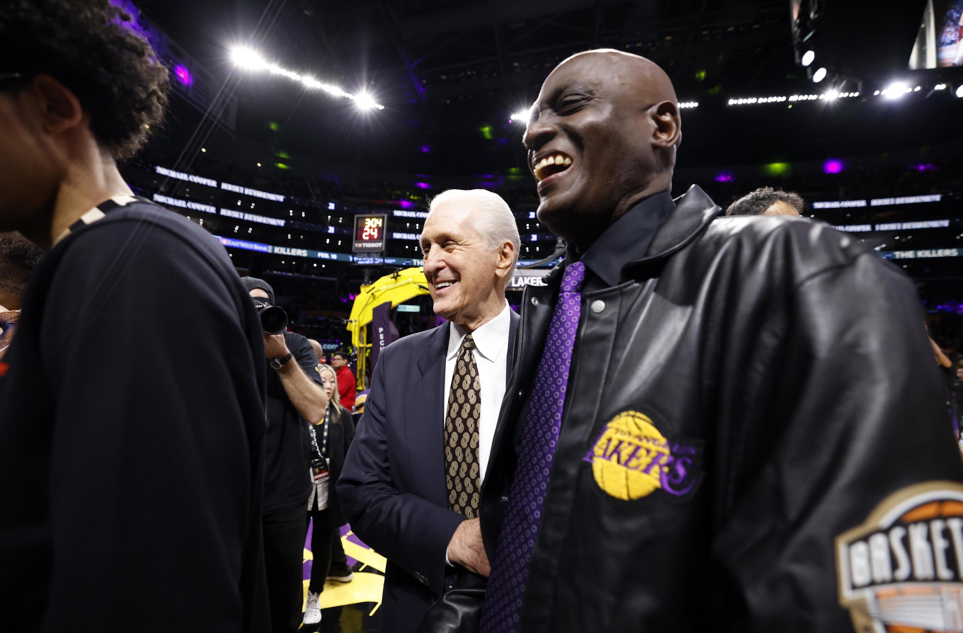 Former Los Angeles Lakers player Michael Cooper and coach Pat Riley.