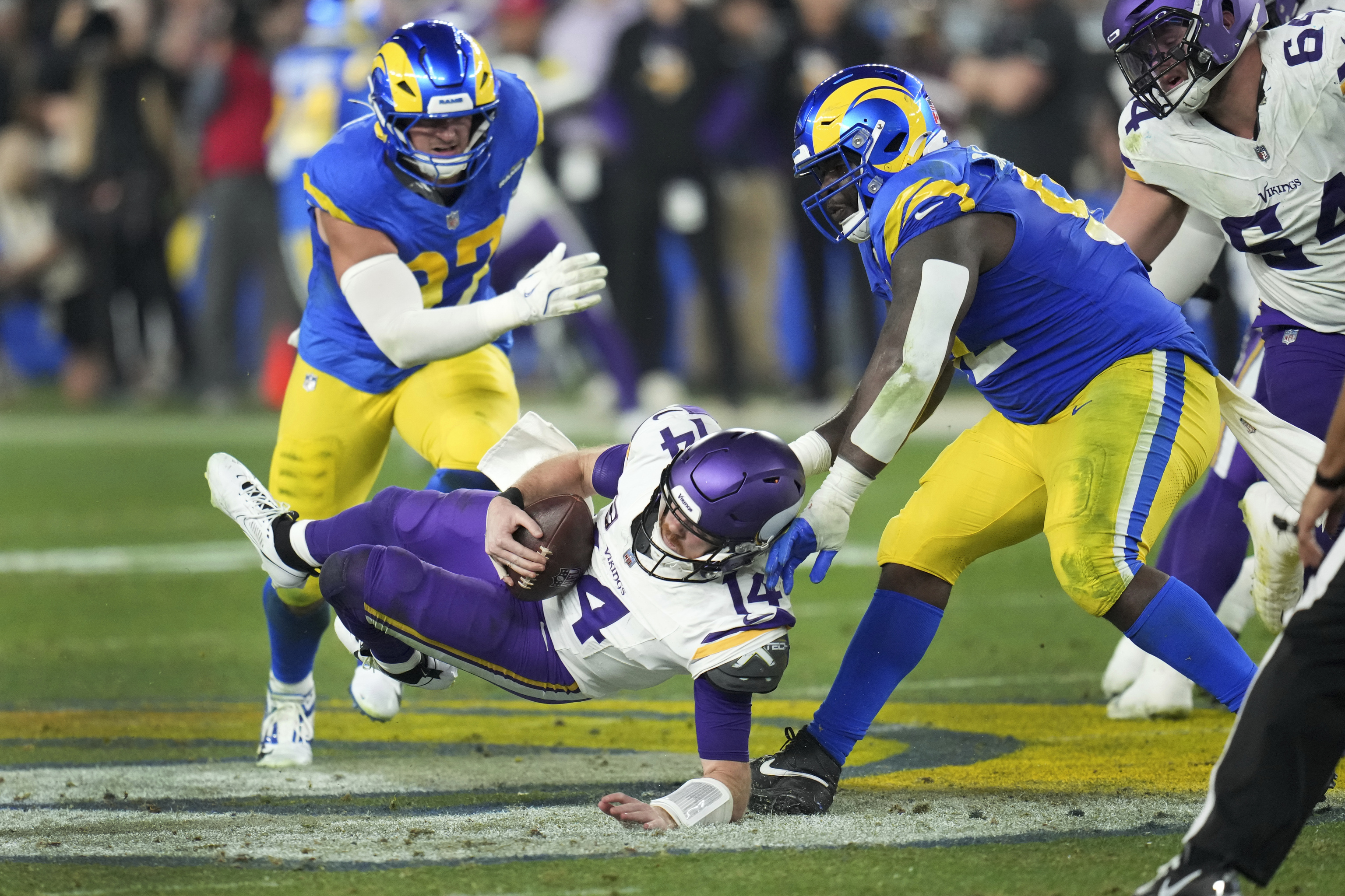 Los Angeles Rams defensive tackle Neville Gallimore (92) sacks Minnesota Vikings quarterback Sam Darnold (14).