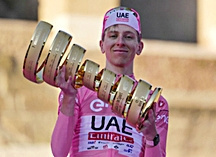 Tour of Italy winner Slovenia's Tadej Pogacar holds the trophy during the podium ceremony at the end of the 21st and last stage of the Giro D'Italia.