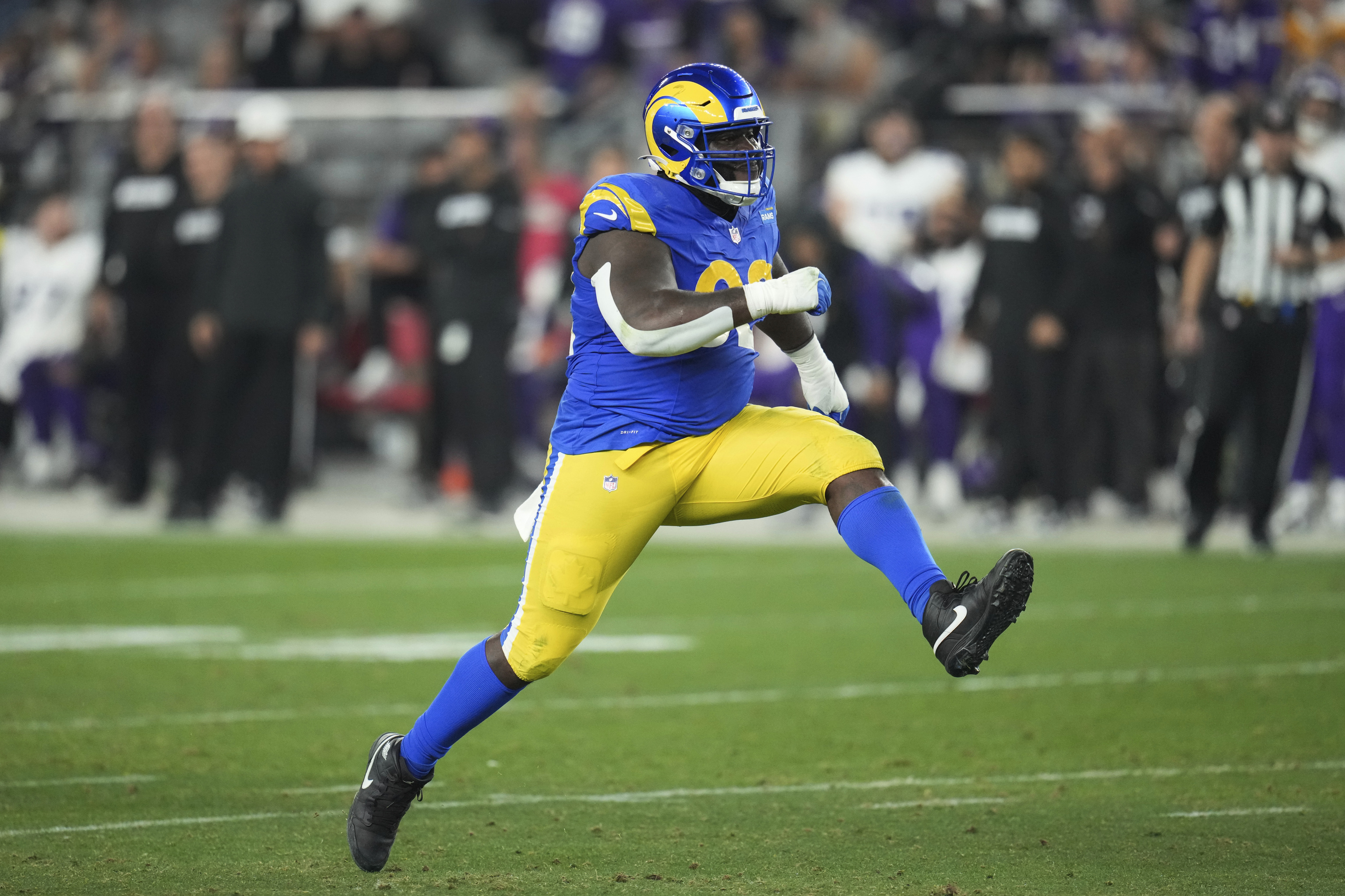 Los Angeles Rams defensive tackle Neville Gallimore (92) reacts to sacking Minnesota Vikings quarterback Sam Darnold.