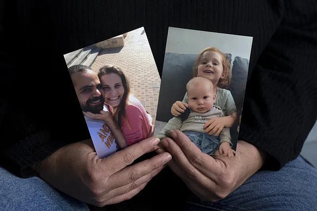 Yifat Zailer shows photos of her family.