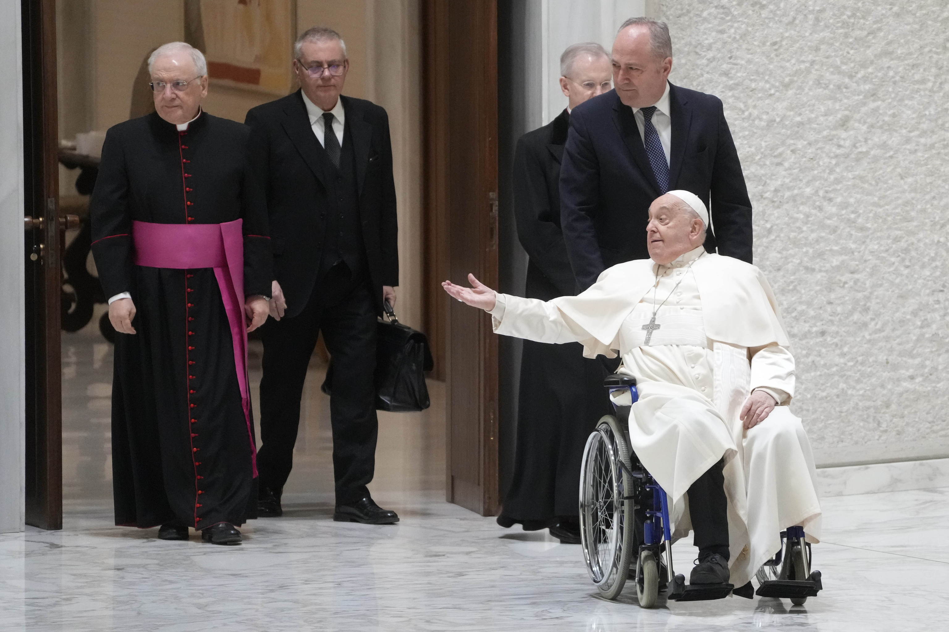 Pope Francis arrives in the Paul VI hall on the occasion of the weekly general audience at the Vatican.