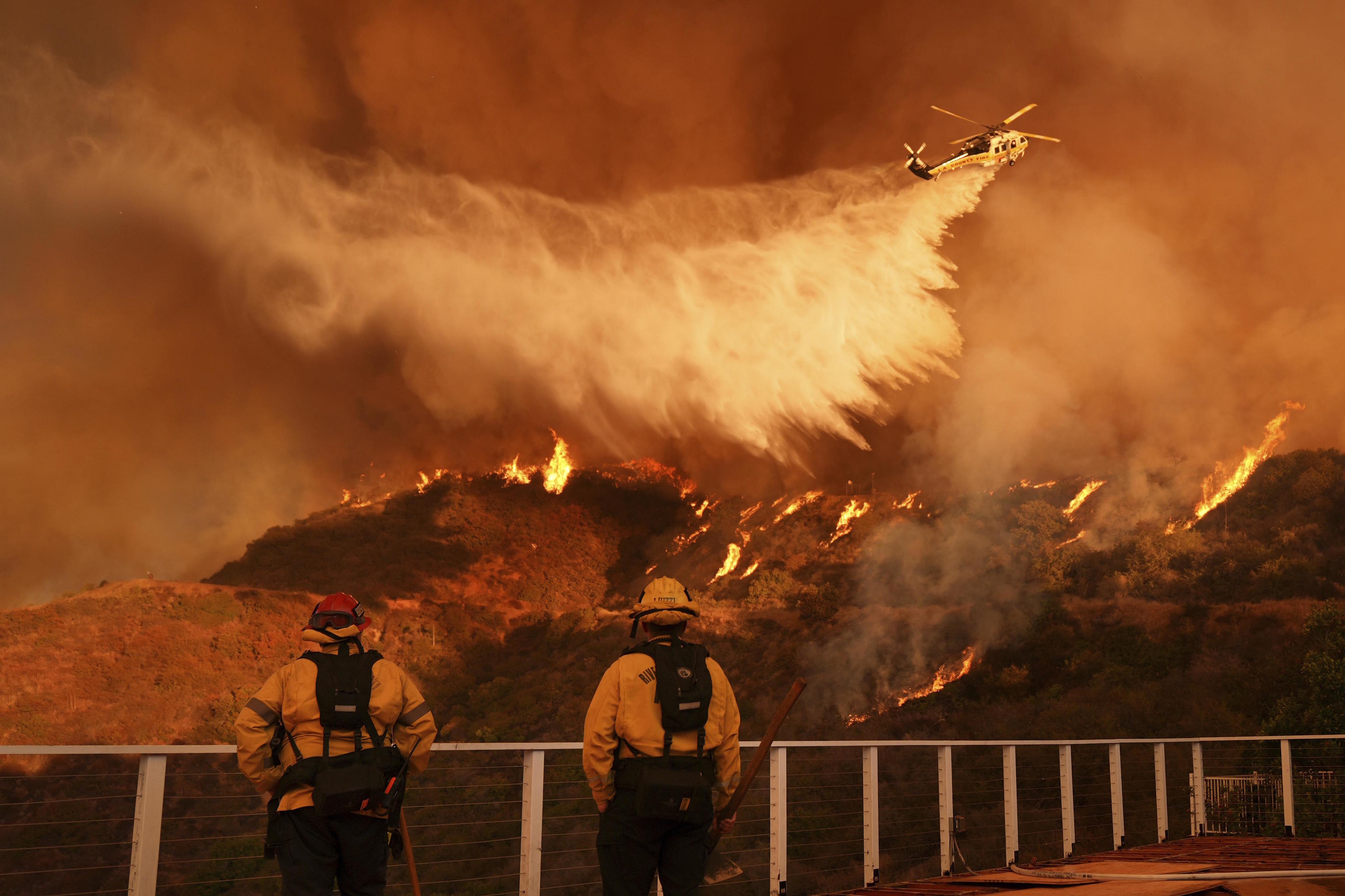 A helicopter is working on the Palisades fire.