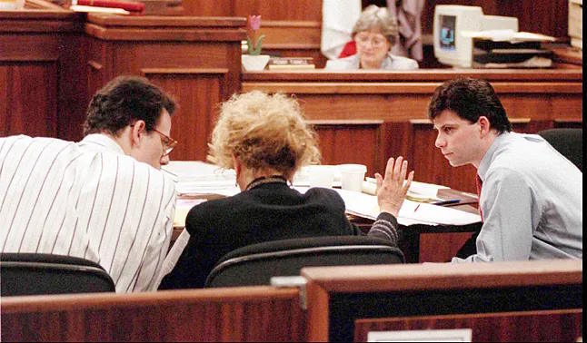 The Menndez brothers with their lawyer during their trialPhil McCarten.