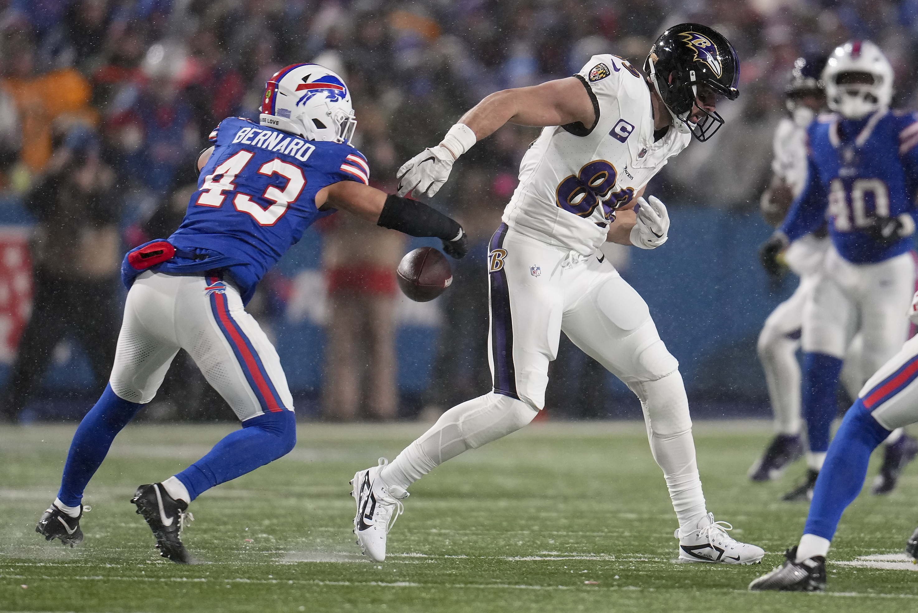 Buffalo Bills linebacker Terrel Bernard (43) strips the ball from Baltimore Ravens tight end Mark Andrews (89).