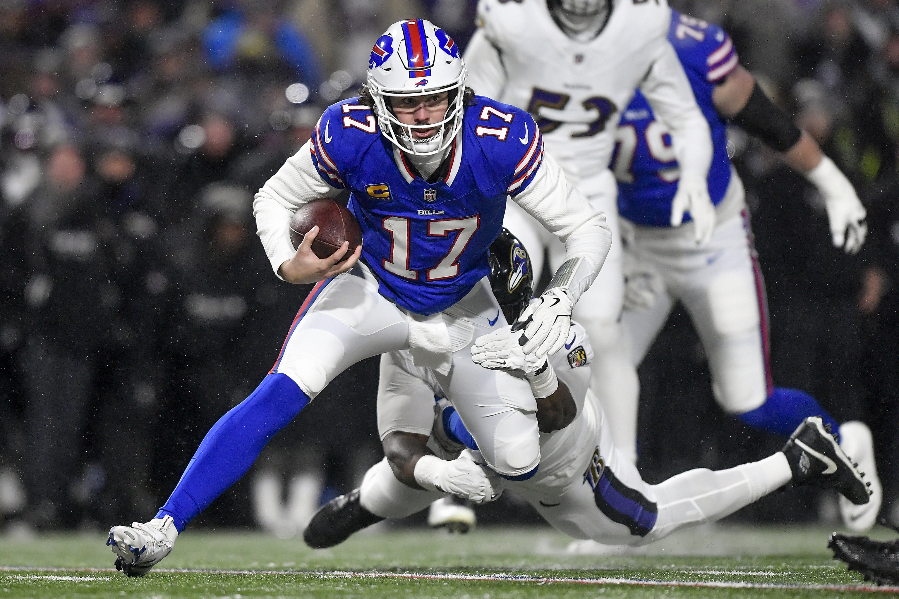 Buffalo Bills quarterback Josh Allen (17) is tackled by Baltimore Ravens defensive tackle Nnamdi Madubuike (92).