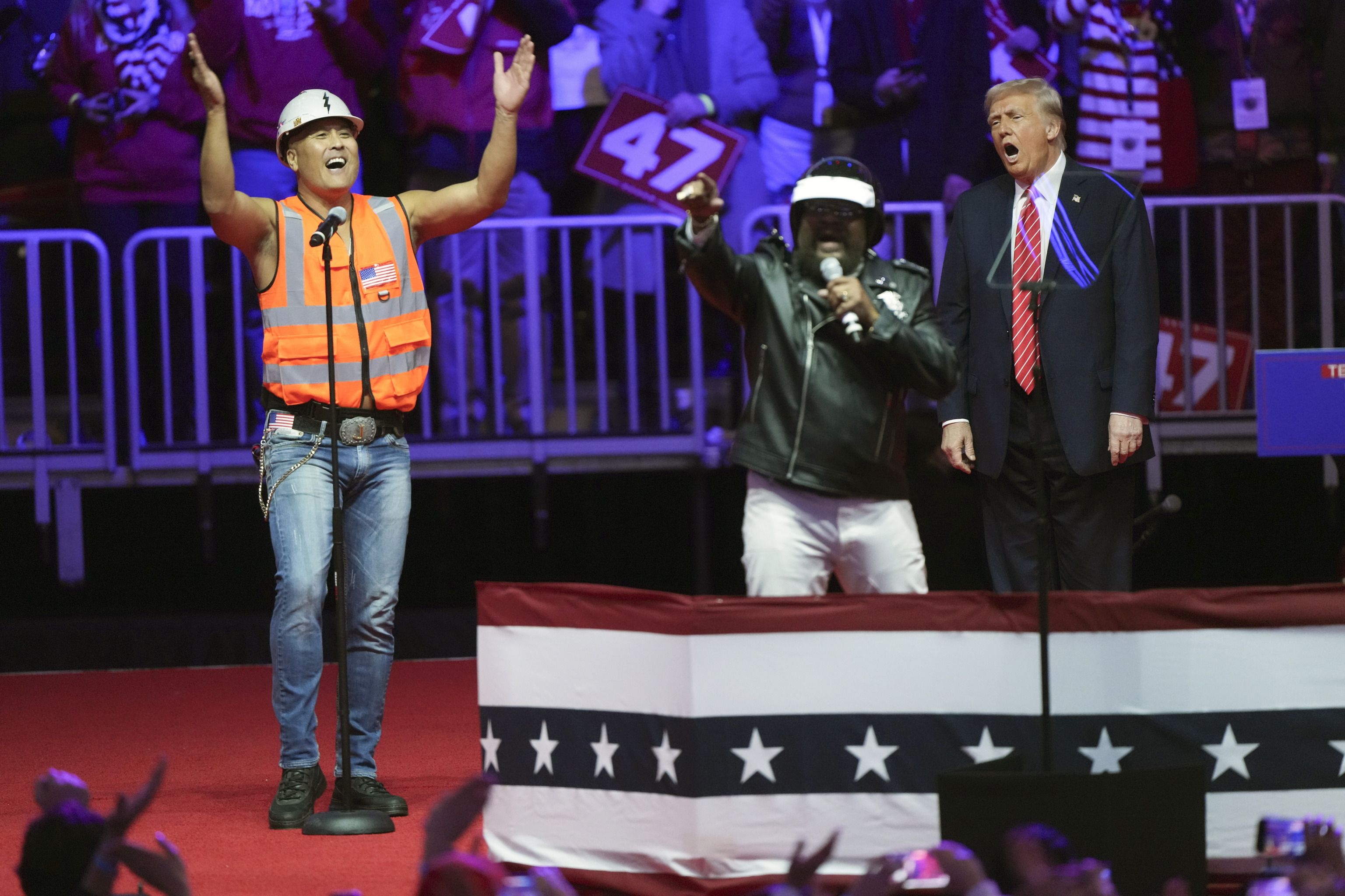 President-elect Donald Trump, right, dances as the Village People perform "Y.M.C.A" at a rally ahead of the 60th Presidential Inauguration.