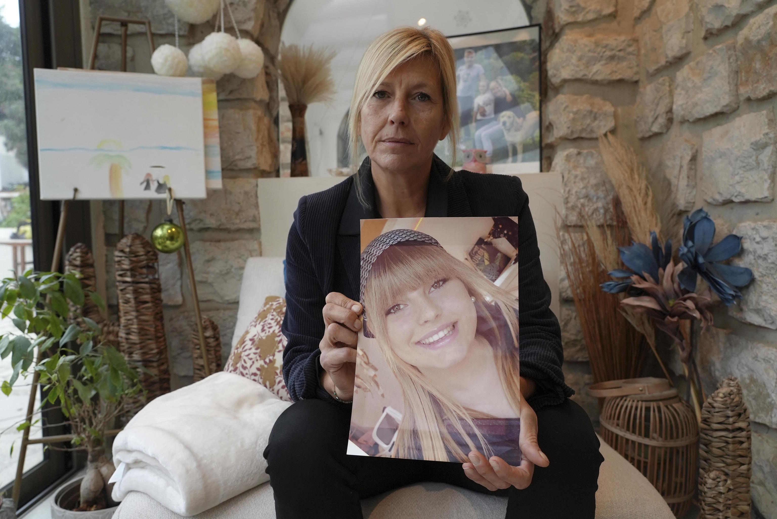 Stephanie Mistre, 51, holds a photo of her daughter, Marie Le Tiec.