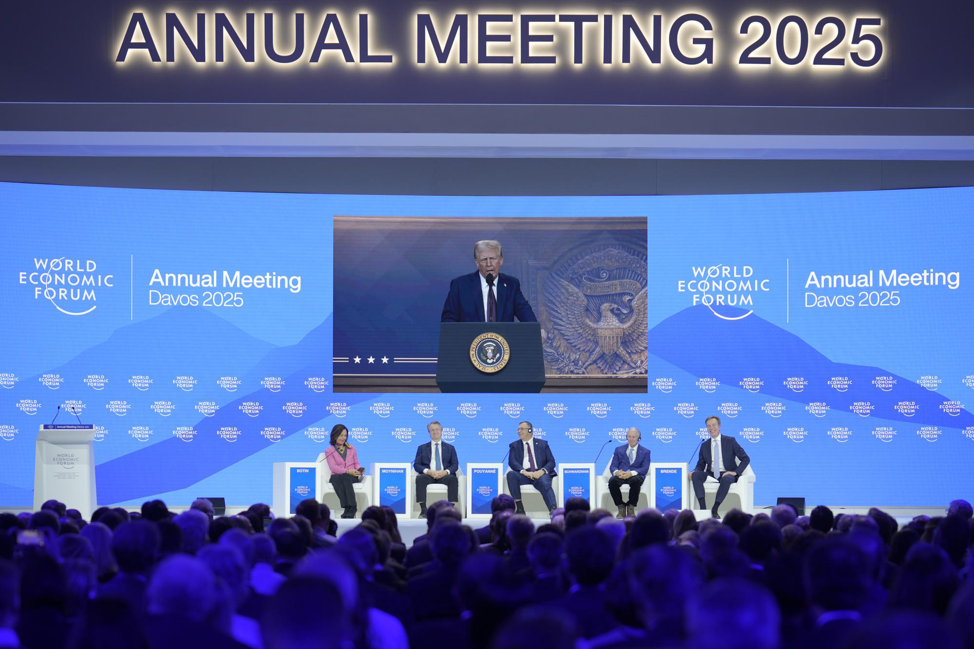 Trump, addressing the audience at Davos with A.Botn, President of Santander Bank.