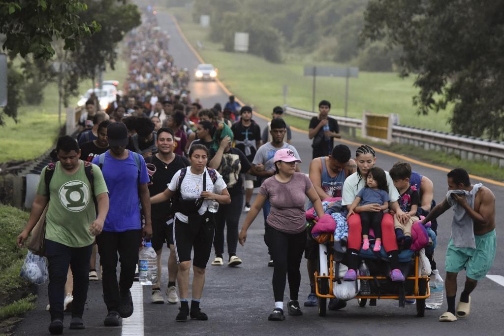 Migrants walk along the Huixtla highway in the state of Chiapas