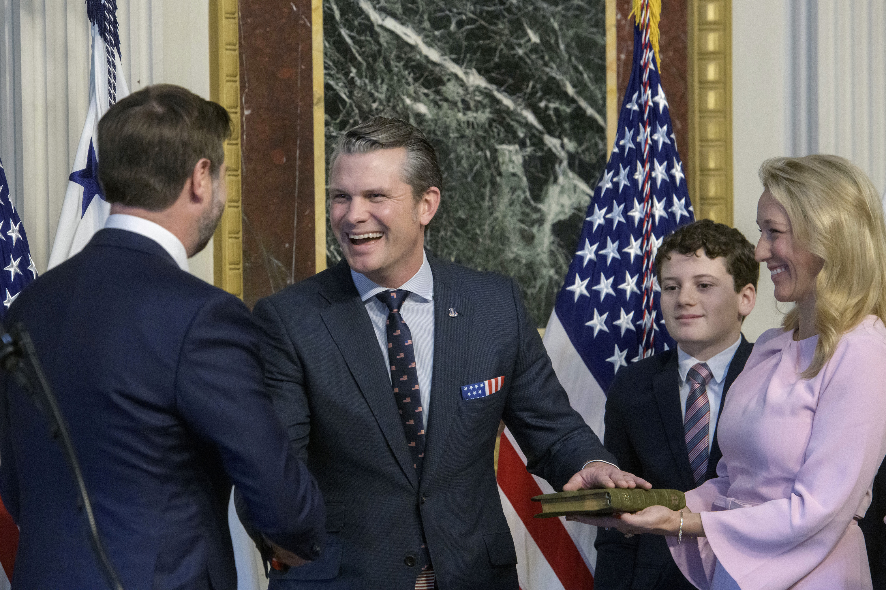 Vice President JD Vance, from left, swears in Pete Hegseth to be Secretary of Defense.