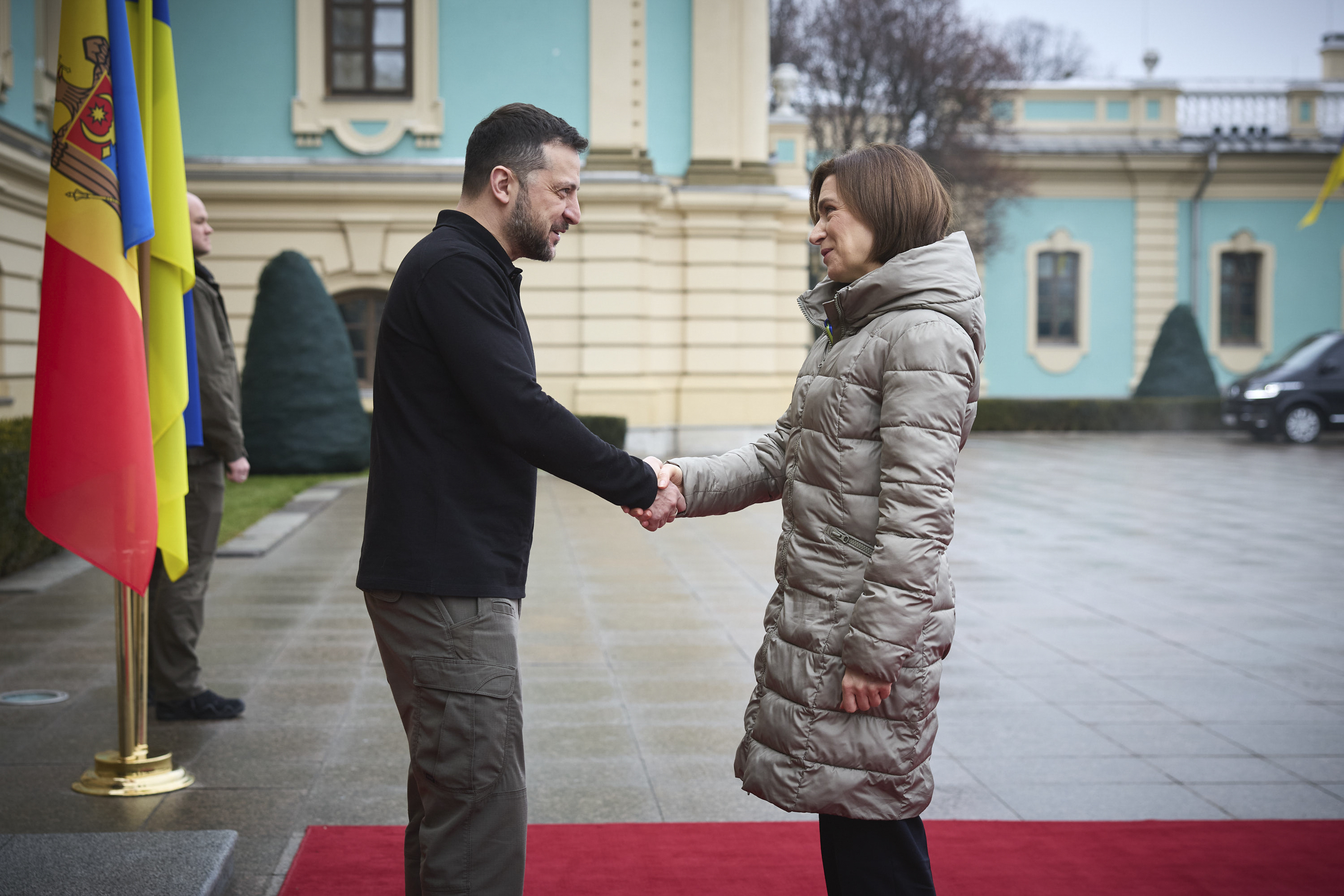 the Ukrainian Presidential Press Office, Ukrainian President Volodymyr Zelenskyy, left, shakes hands with President of Moldova Maia Sandu.