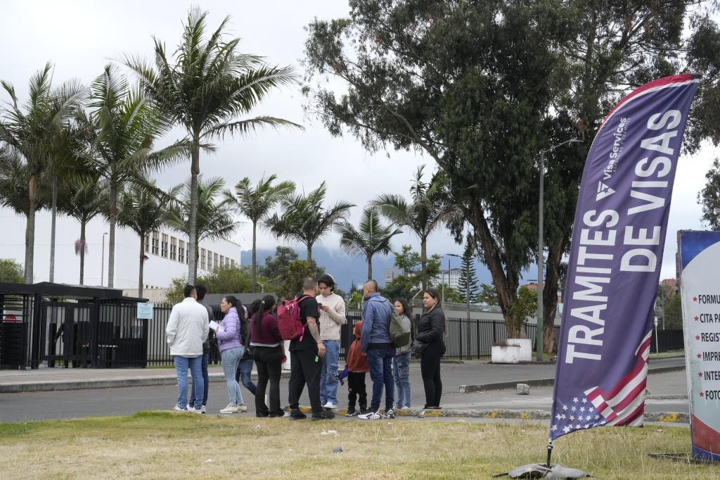 People stand outside the U.S. embassy in Bogota, Colombia