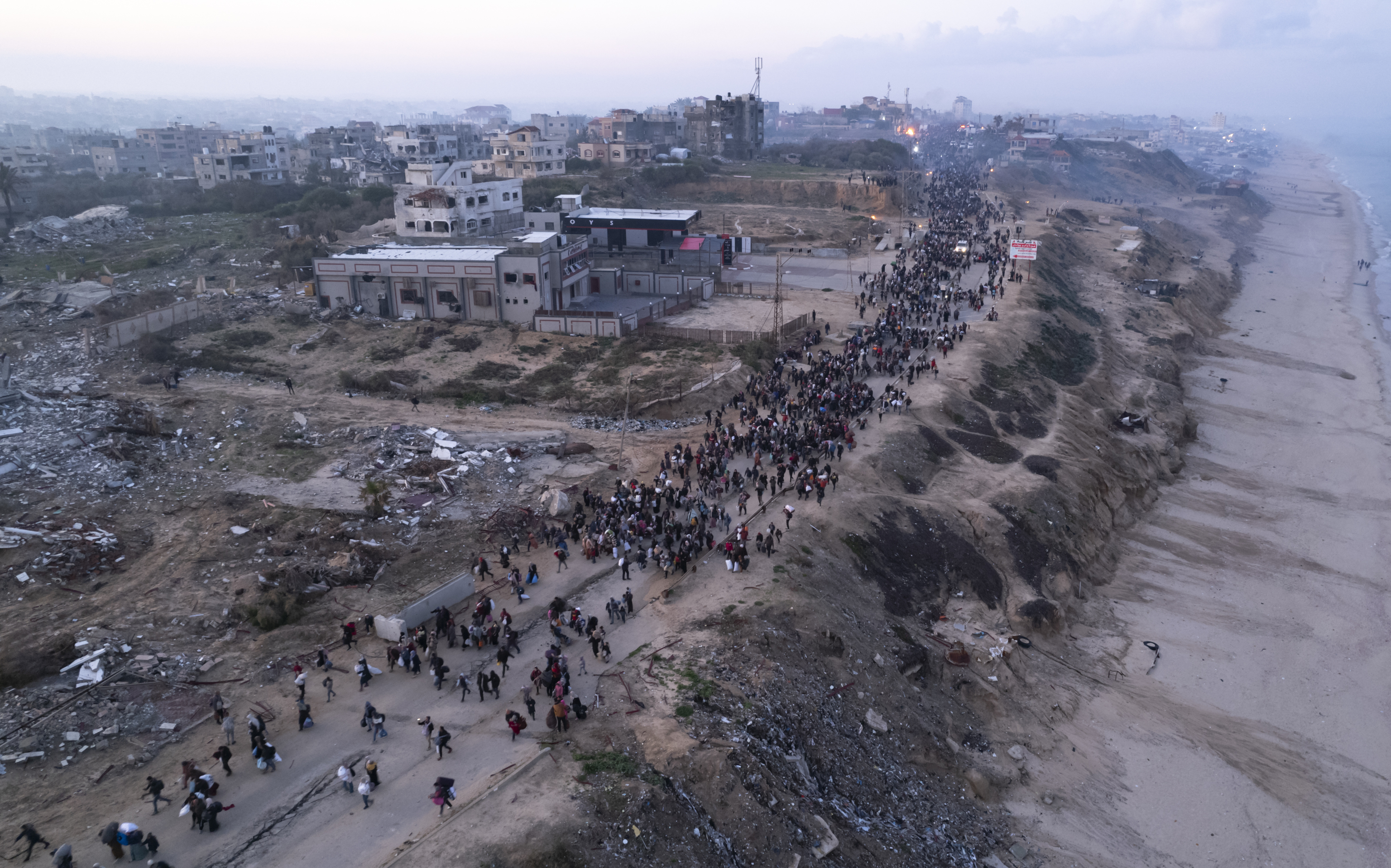 An aerial photograph taken by a drone shows displaced Palestinians return to their homes in the northern Gaza.