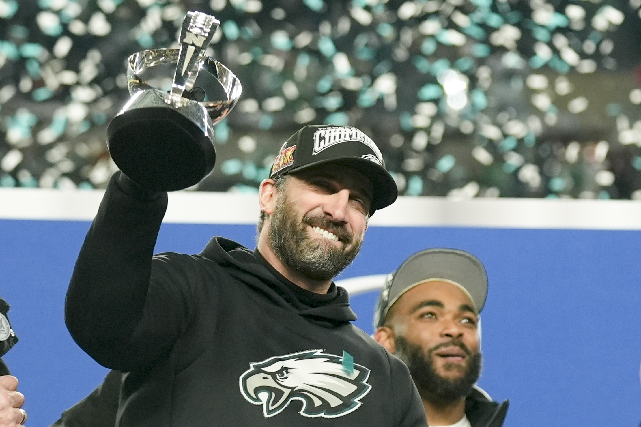 Philadelphia Eagles head coach Nick Sirianni celebrates with the trophy after their win against the Washington Commanders.