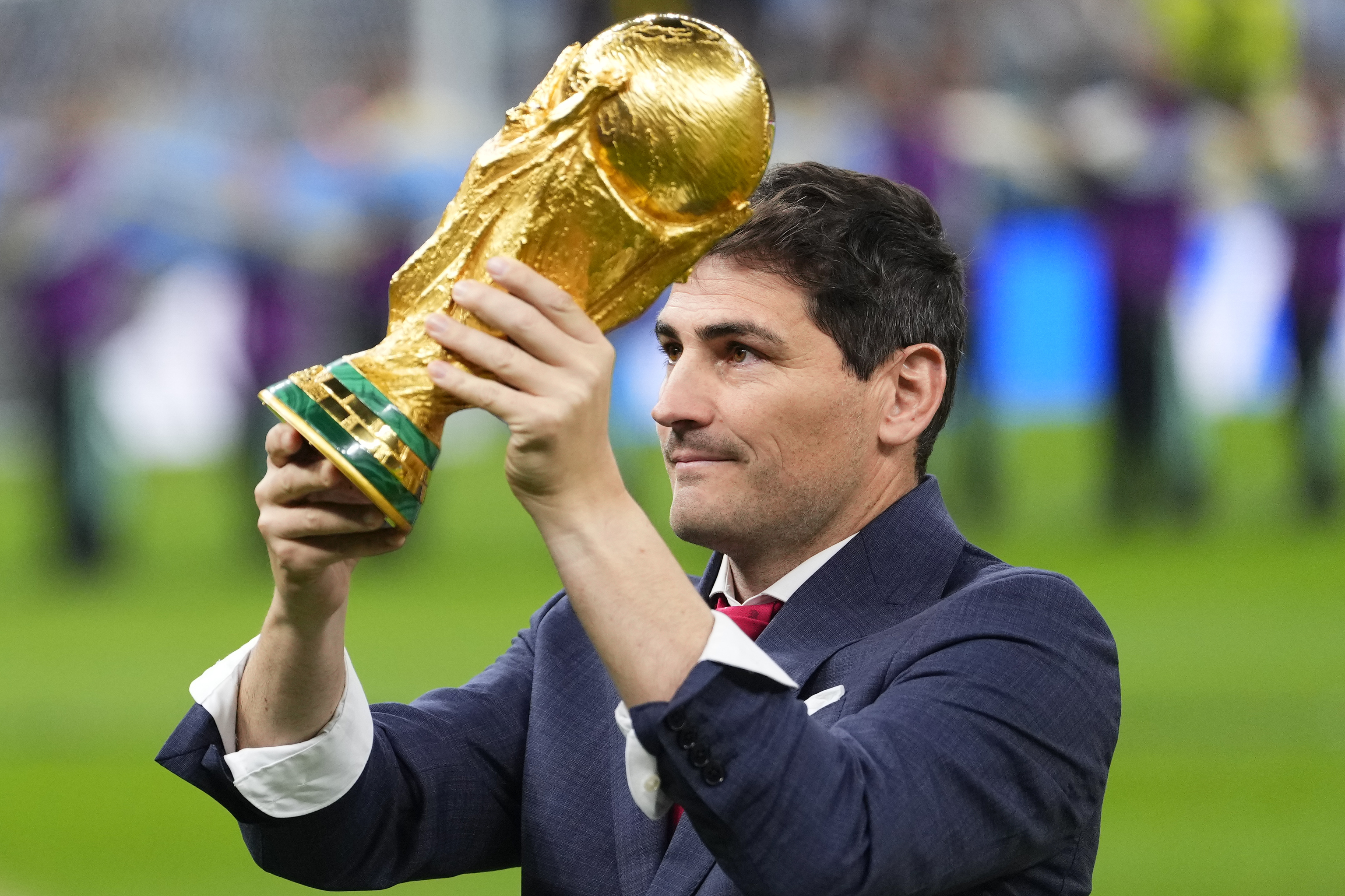 Iker Casillas holds the trophy before the World Cup final.