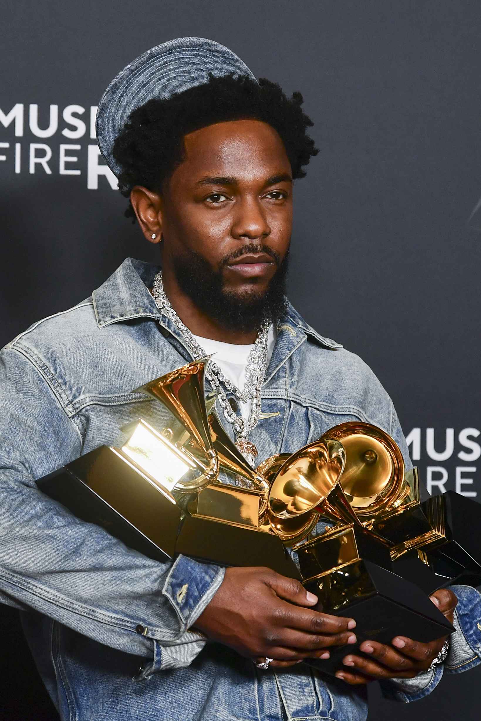 Kendrick Lamar poses in the press room.