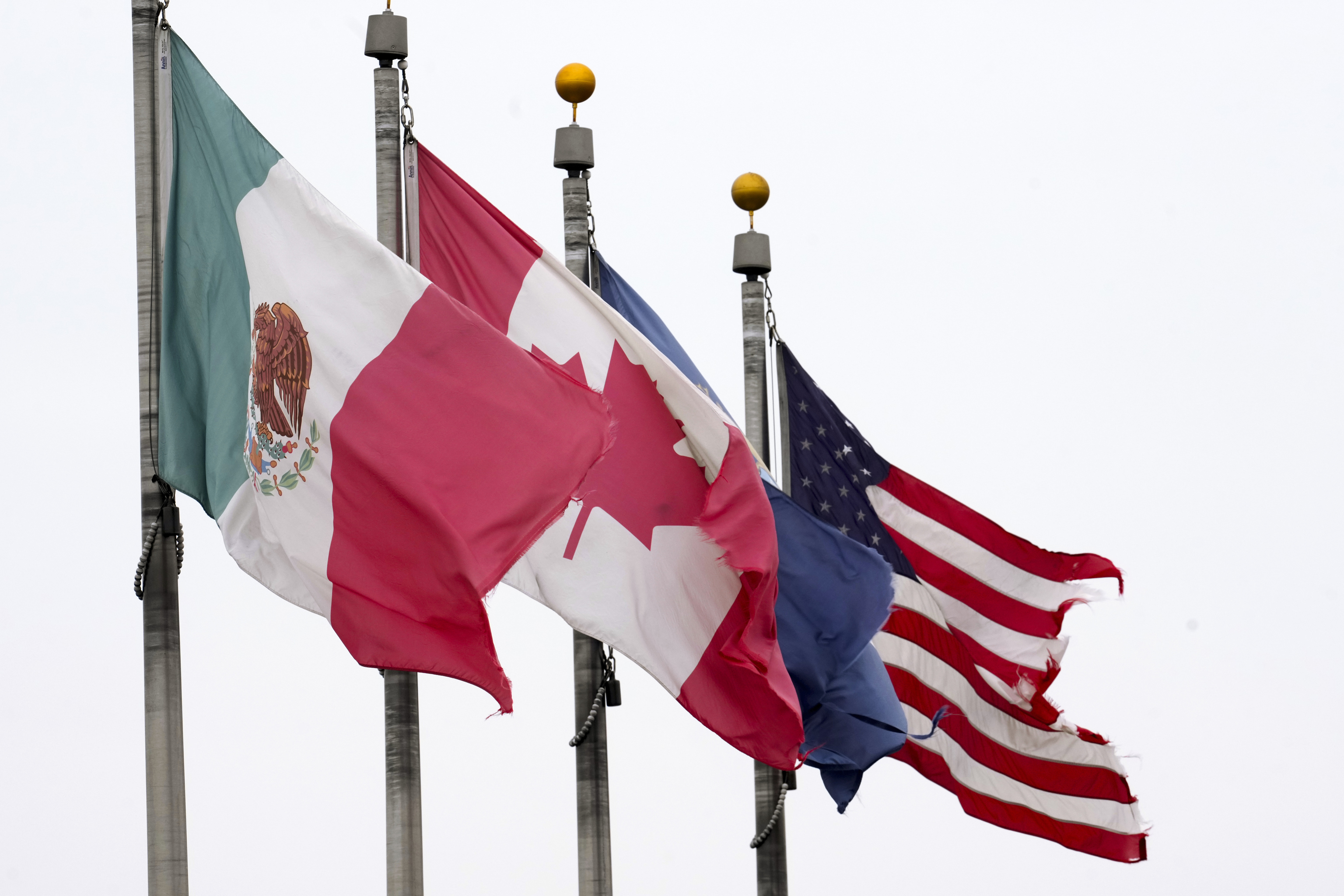 The flags of Mexico, Canada and the United States are shown near the Ambassador Bridge.