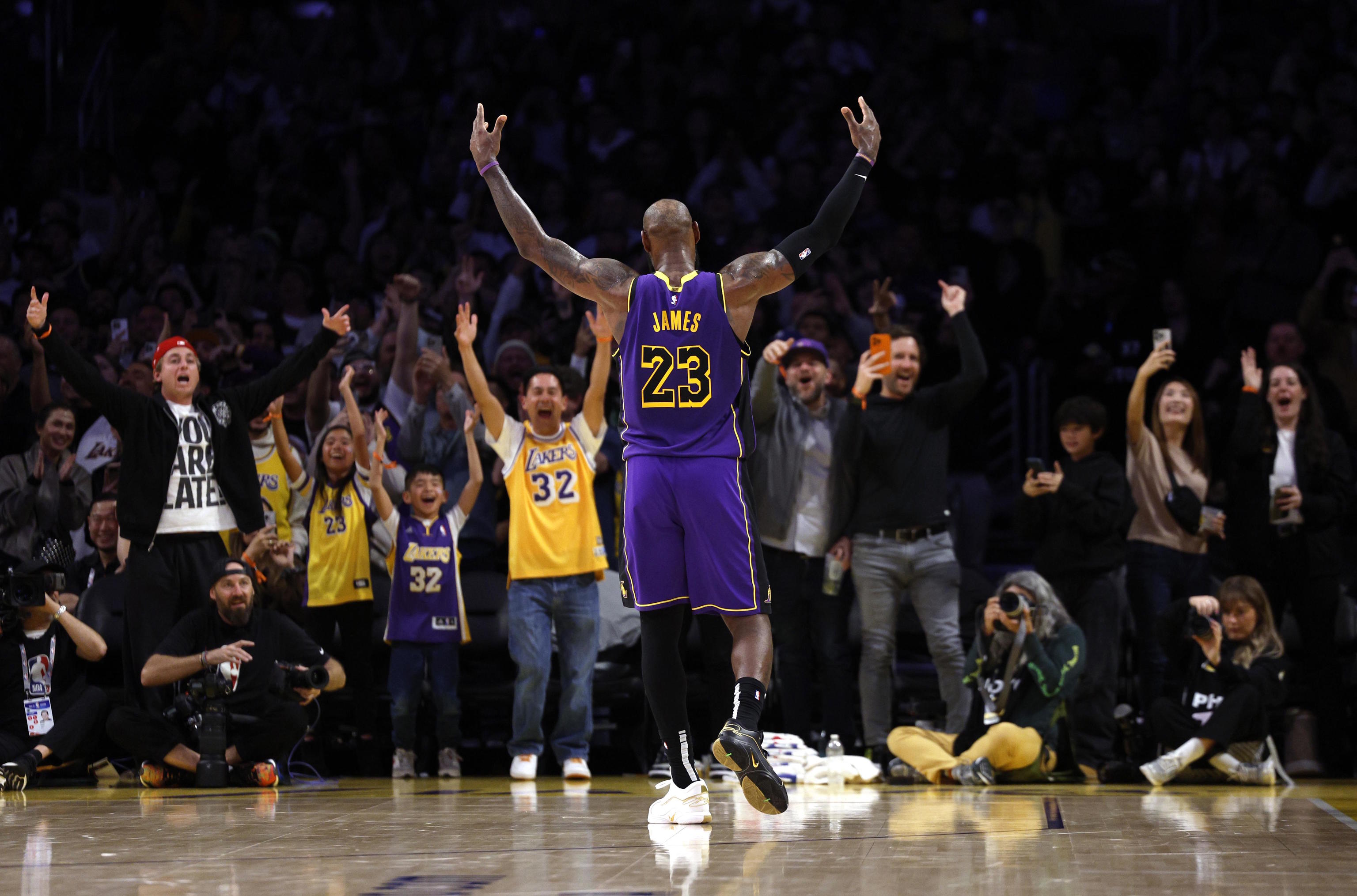 LeBron James celebrates with fans after defeating the Golden State Warriors.