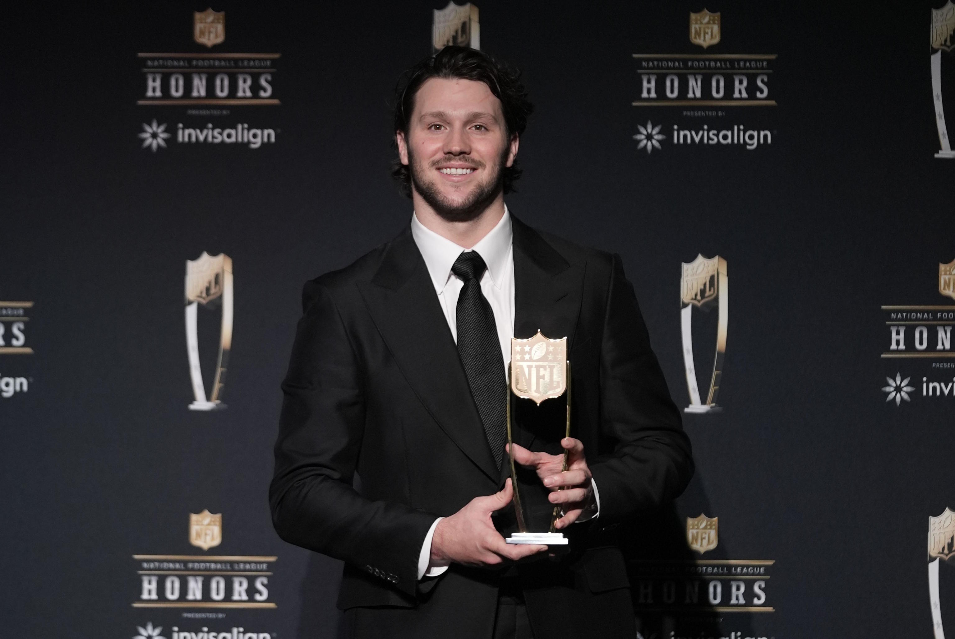 Allen poses with the Most Valuable Player award at the NFL Honors award.