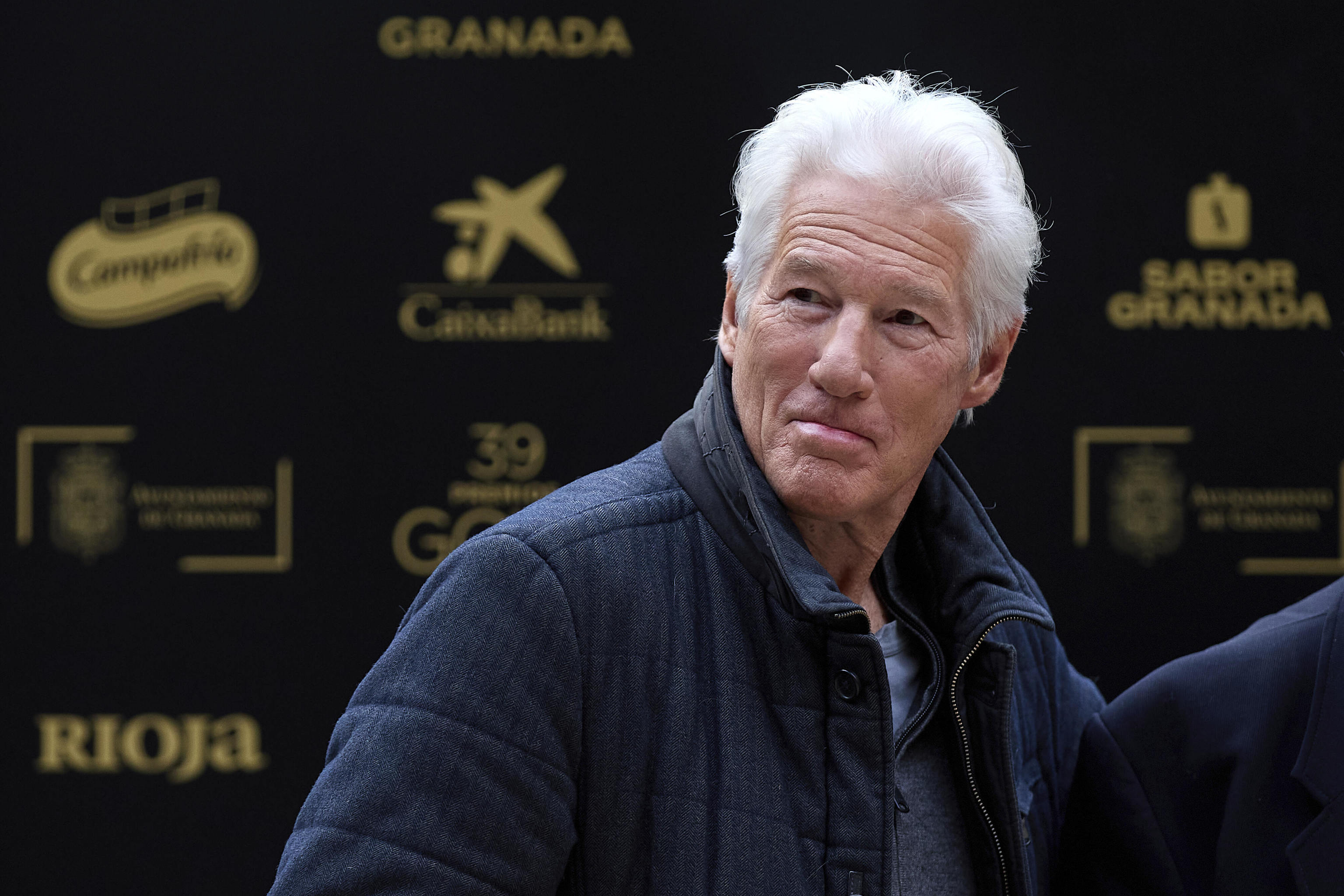 Actor Richard Gere arrives for a photocall.