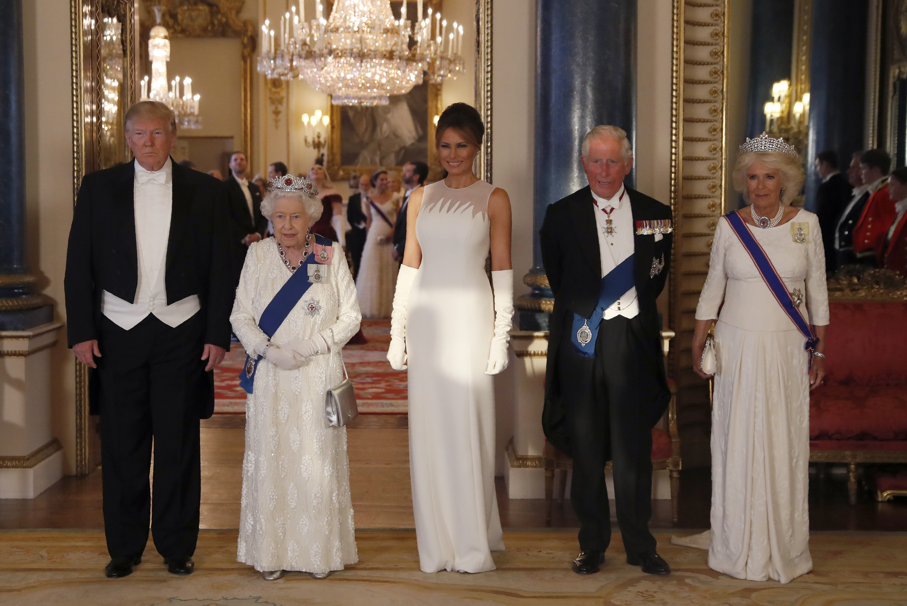 From left, US President Donald Trump, Britain's Queen Elizabeth II, first lady Melania Trump, Prince Charles and Camilla, the Duchess of Cornwall.