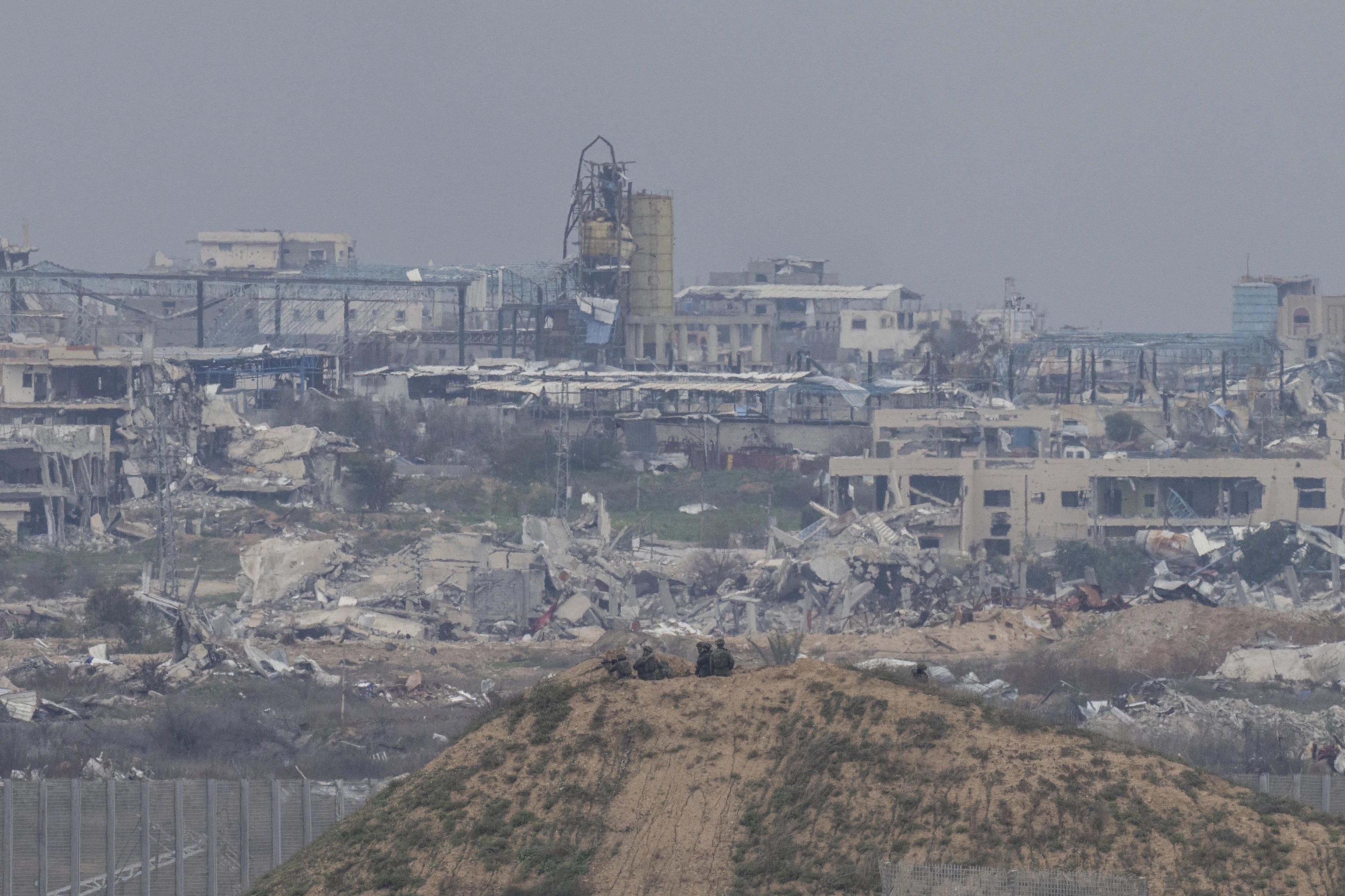 Israeli soldiers take positions near the border with Gaza in southern Israel.