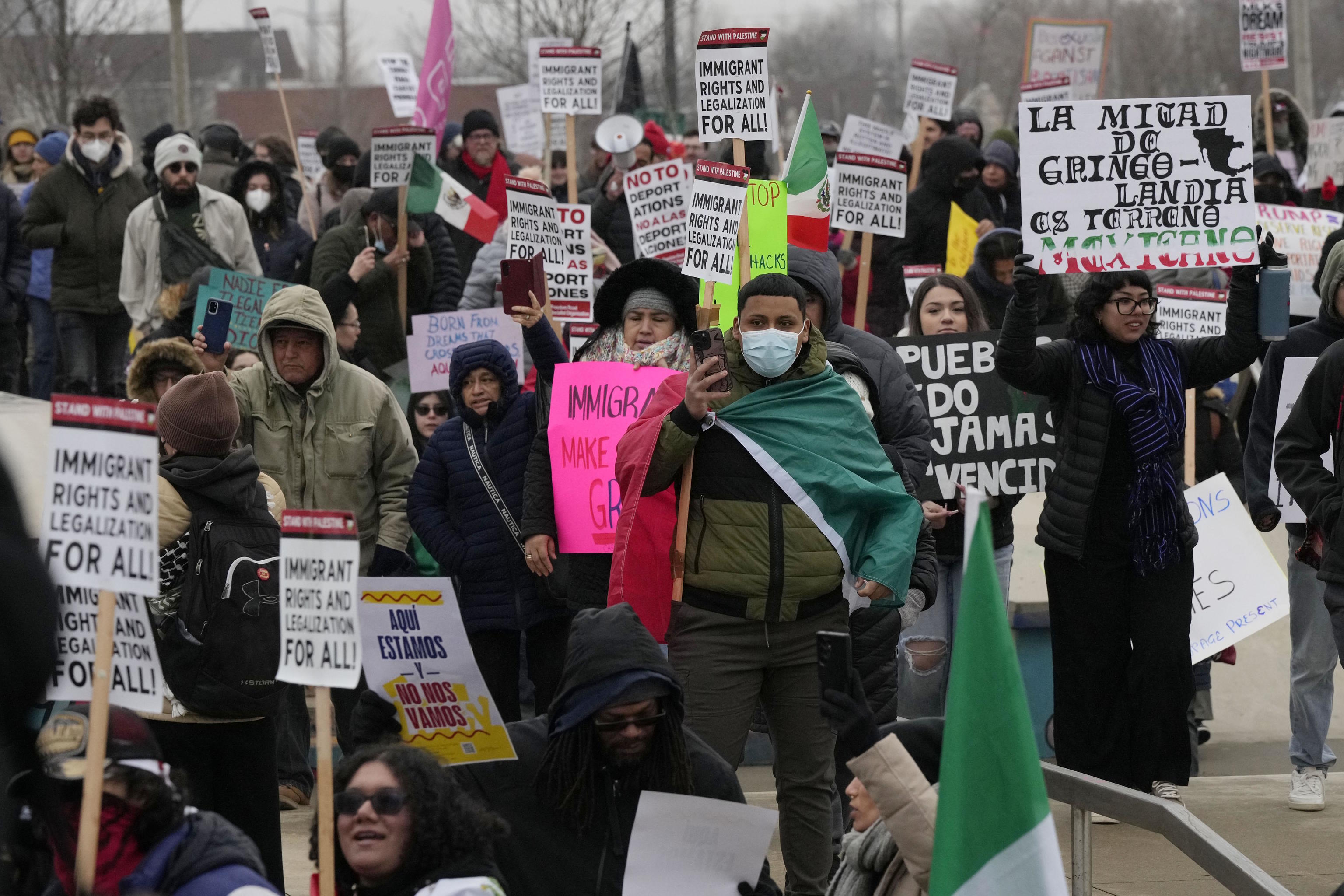 People during the Stop The Attacks on Immigrants protest in Chicago.