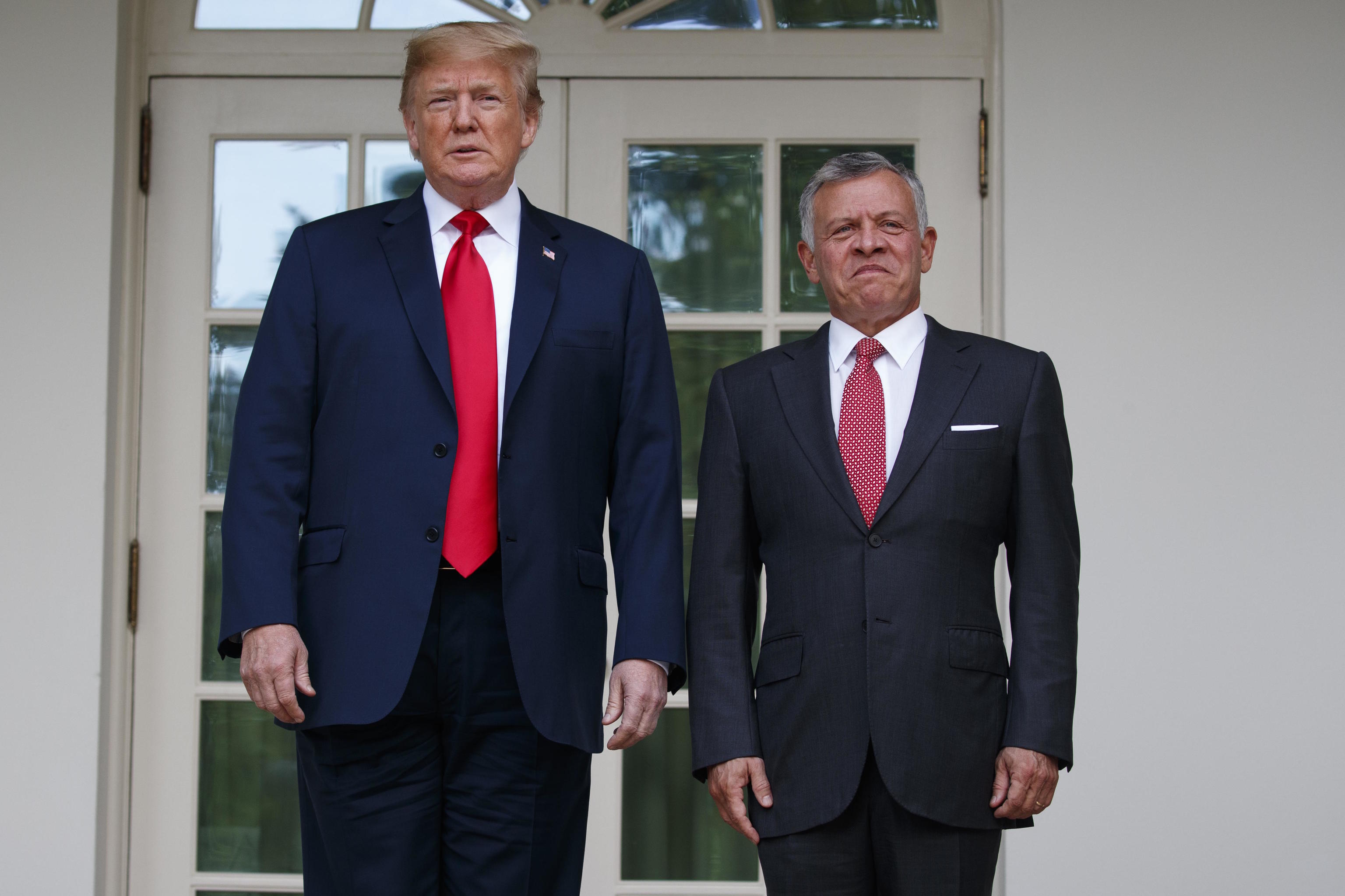 Trump stands with Jordan's King Abdullah II at the White House in 2018.