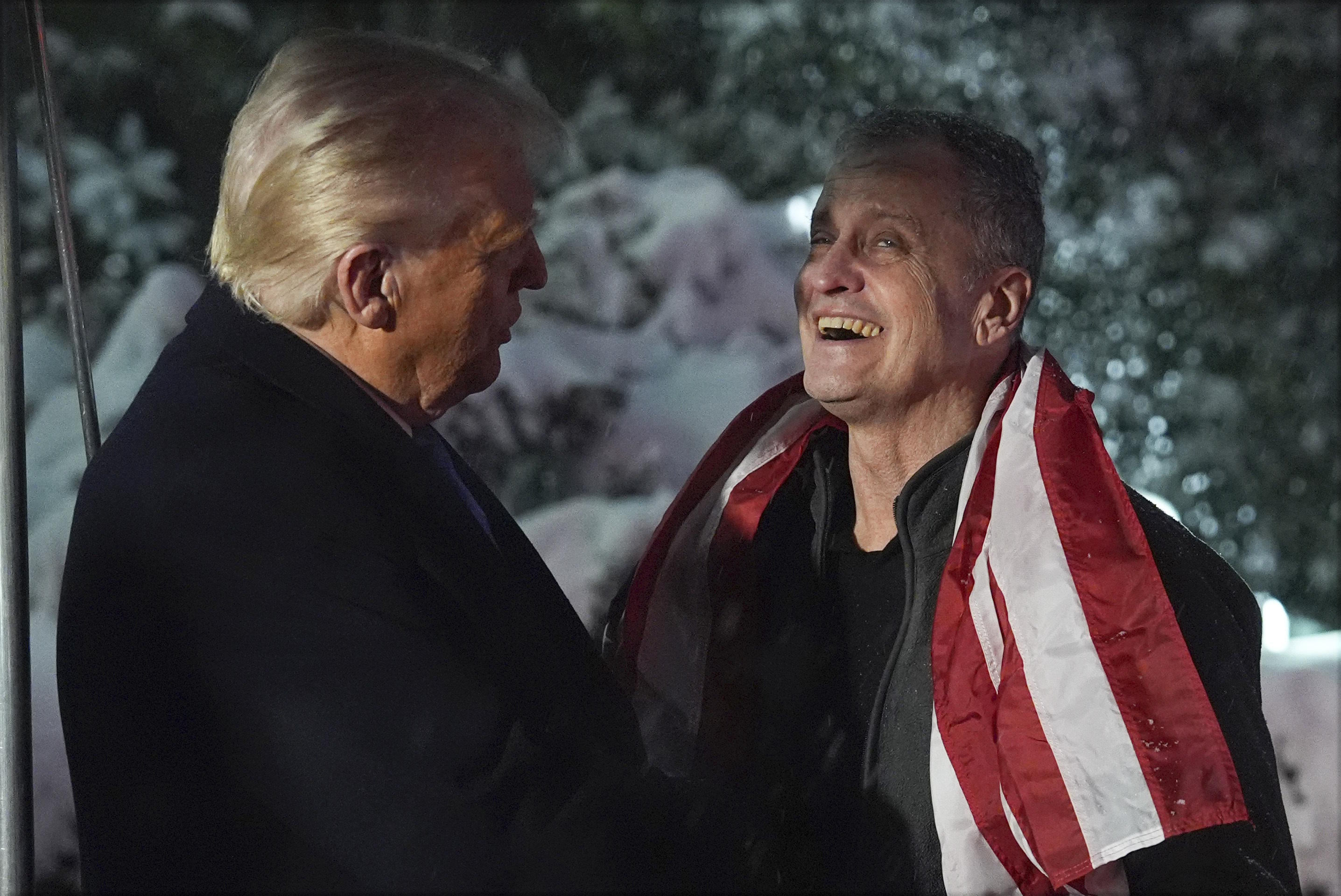 President Donald Trump, greets Marc Fogel at the White House.