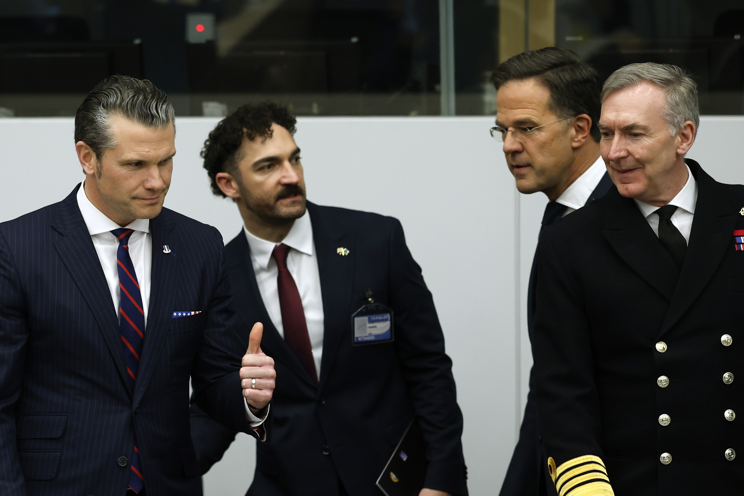 United States Secretary of Defense Pete Hegseth, left, Britian's Chief of Defense Admiral Sir Tony Radakin, right, and NATO Secretary General Mark Rutte.