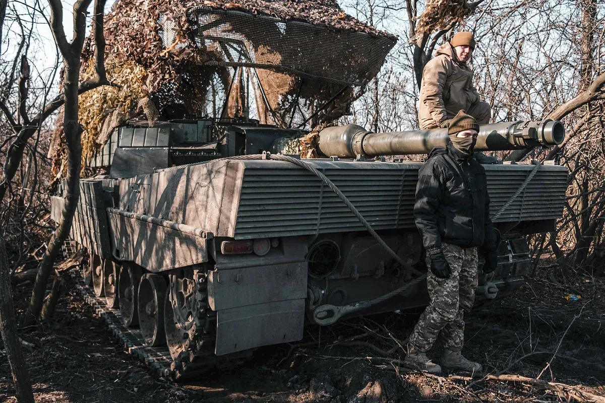 Dmitro, alias 'Green', with another crew member in his Leopard.