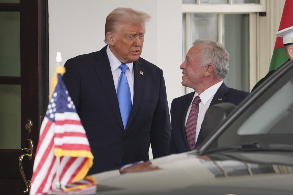 President Donald Trump greets Jordan's King Abdullah II at the White House