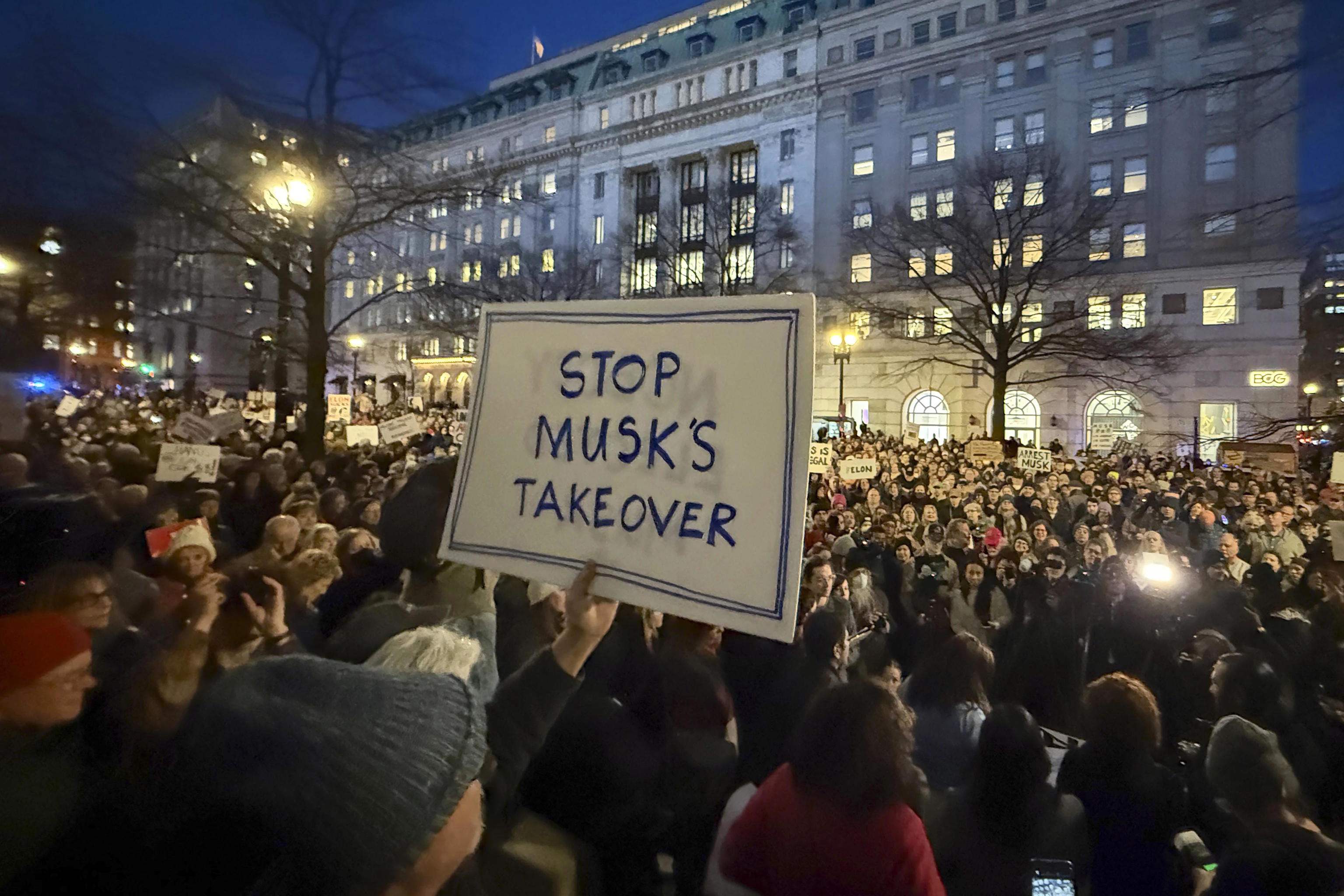 Several people protest a year ago during a rally outside the Treasury Department in Washington.