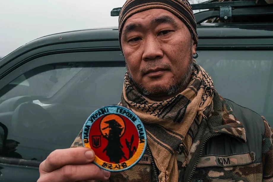 Kim proudly displays the "warrior of the flower" on his patch.